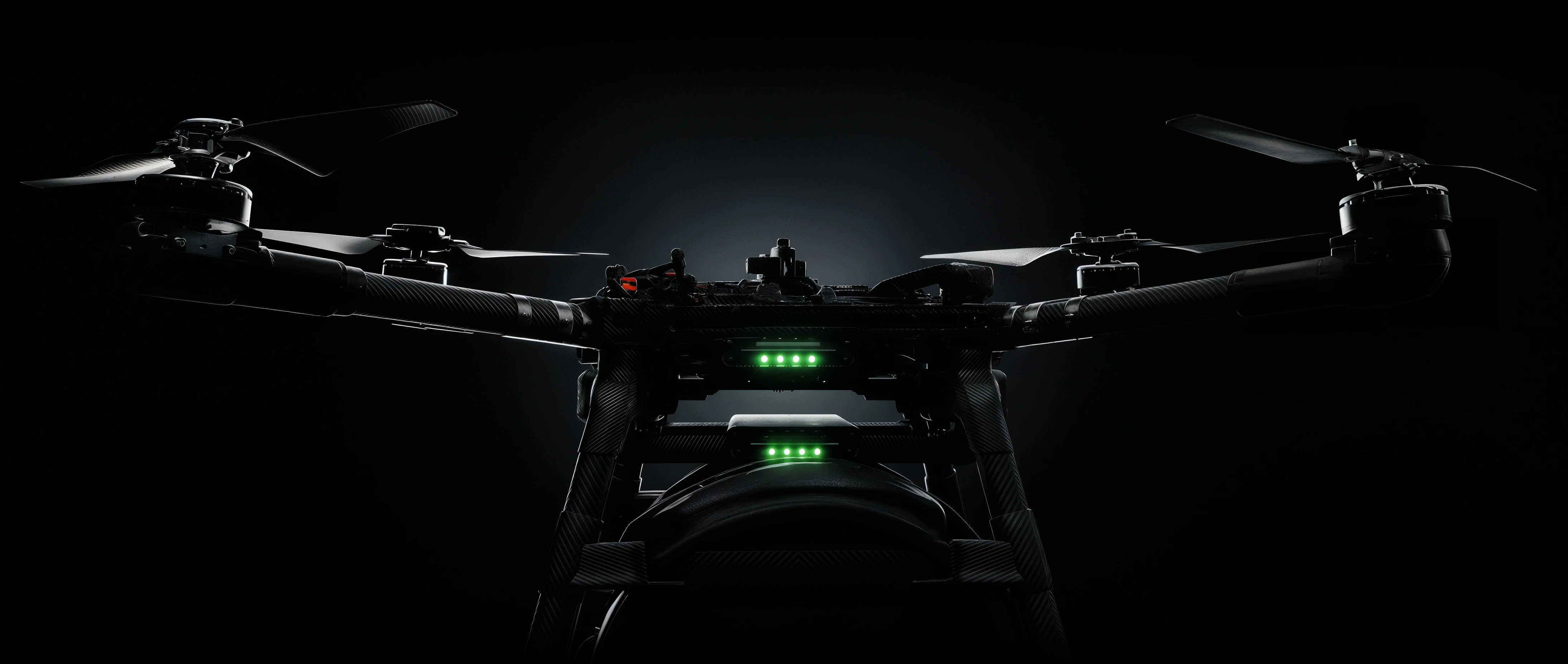 Front-facing view of the drone and its common attachment mount, backlit